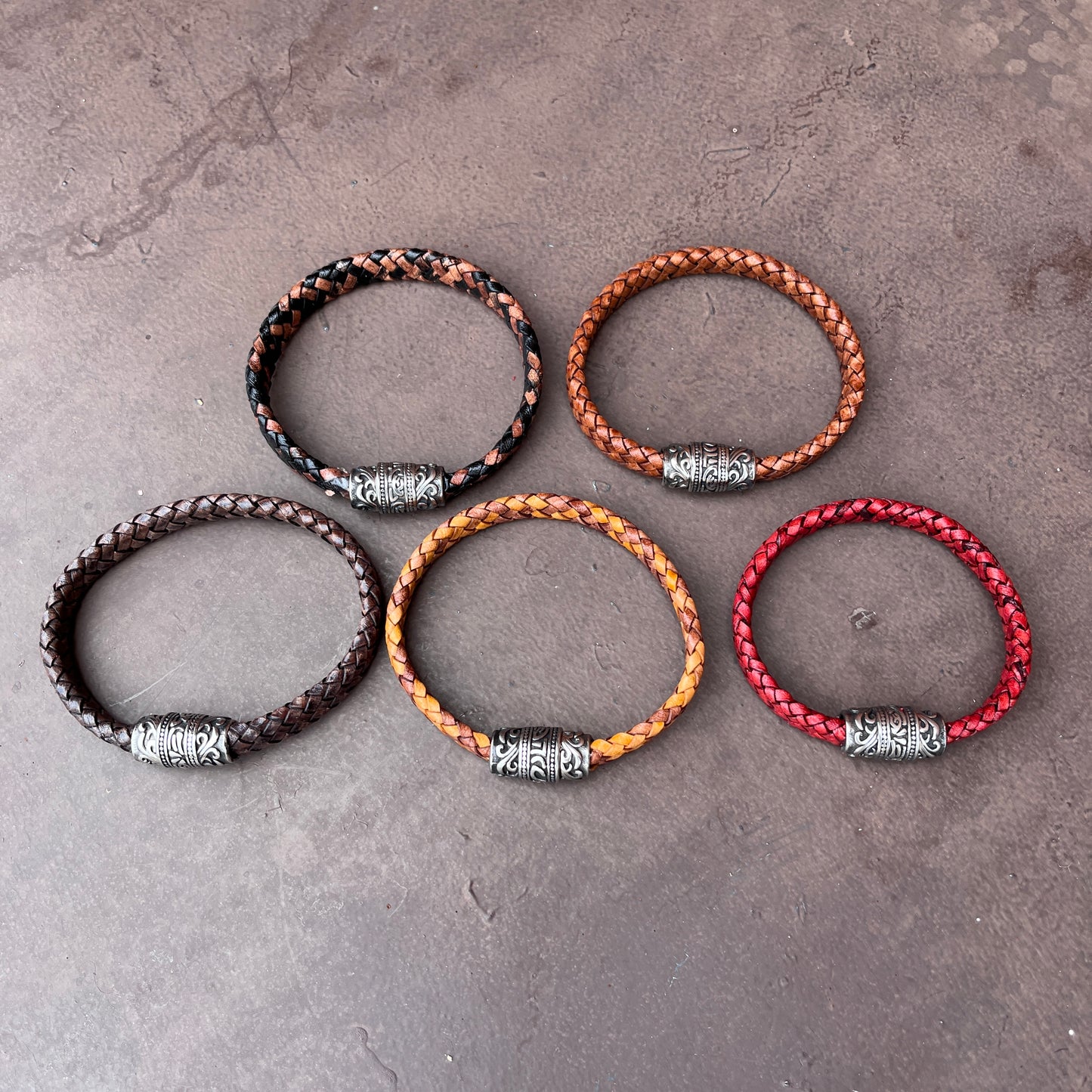 BRAIDED FLAT LEATHER BRACELET WITH STAINLESS STEEL TRIBAL MAGNET CLASP