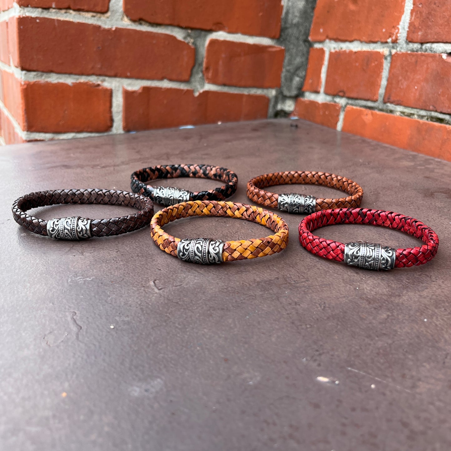 BRAIDED FLAT LEATHER BRACELET WITH STAINLESS STEEL TRIBAL MAGNET CLASP