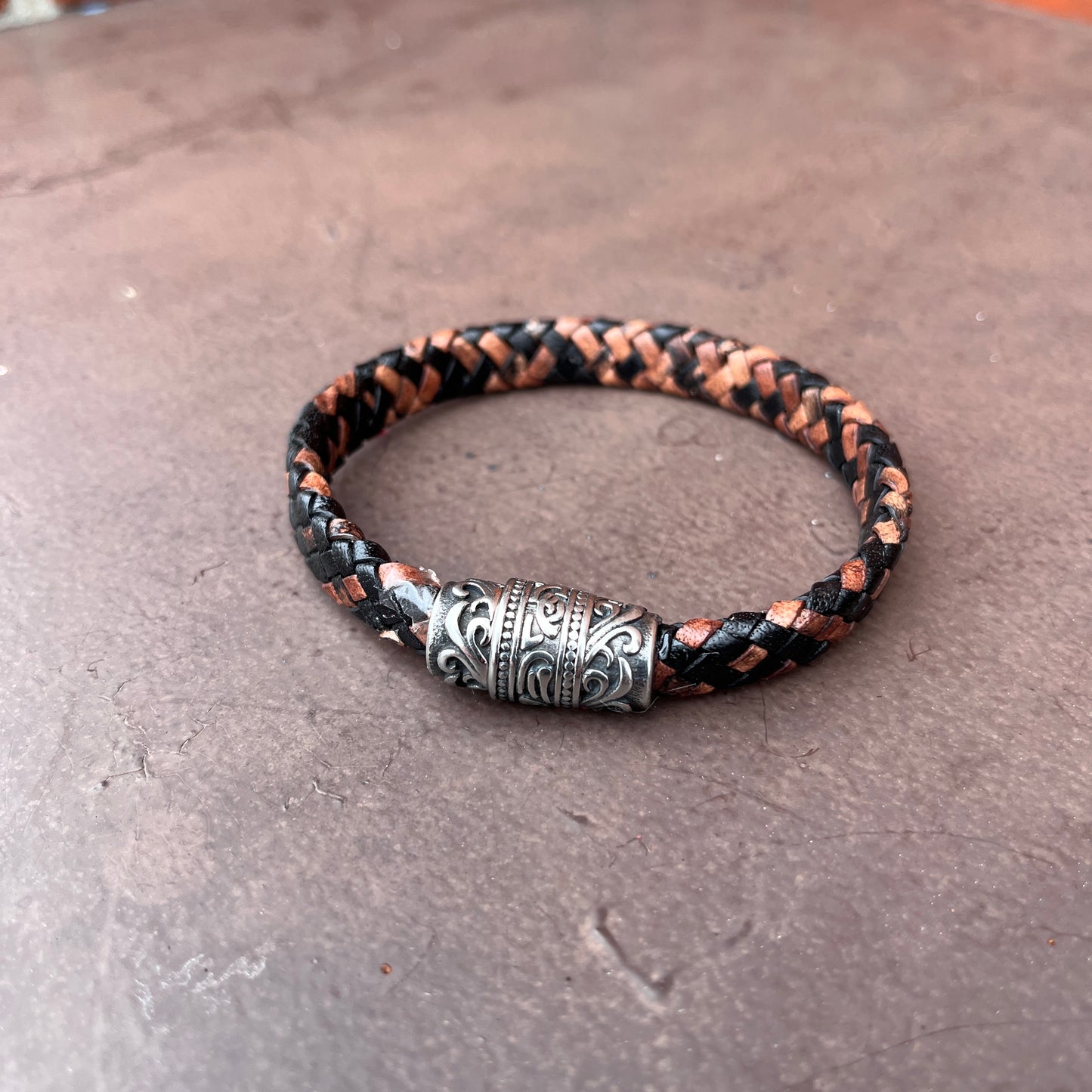 BRAIDED FLAT LEATHER BRACELET WITH STAINLESS STEEL TRIBAL MAGNET CLASP