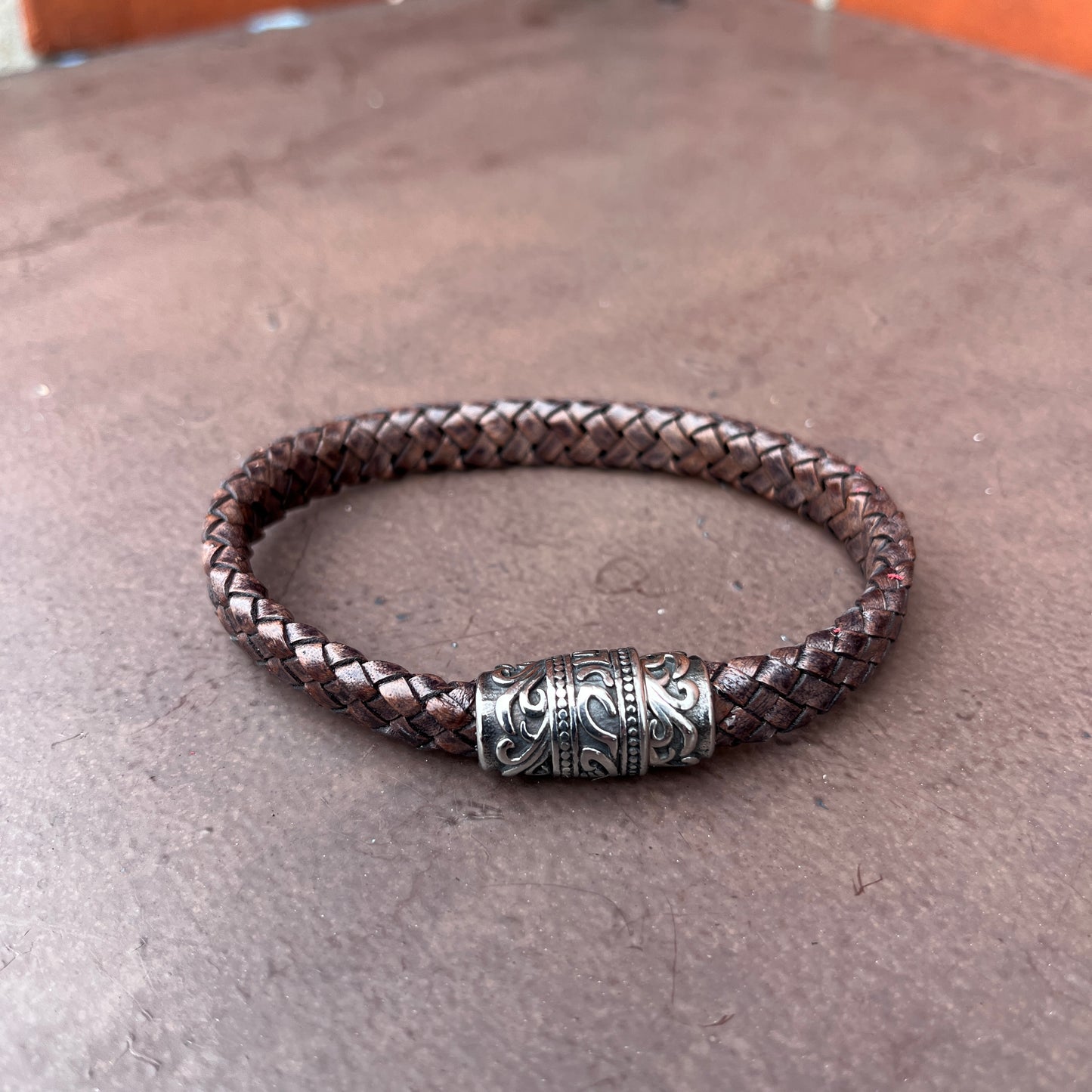 BRAIDED FLAT LEATHER BRACELET WITH STAINLESS STEEL TRIBAL MAGNET CLASP