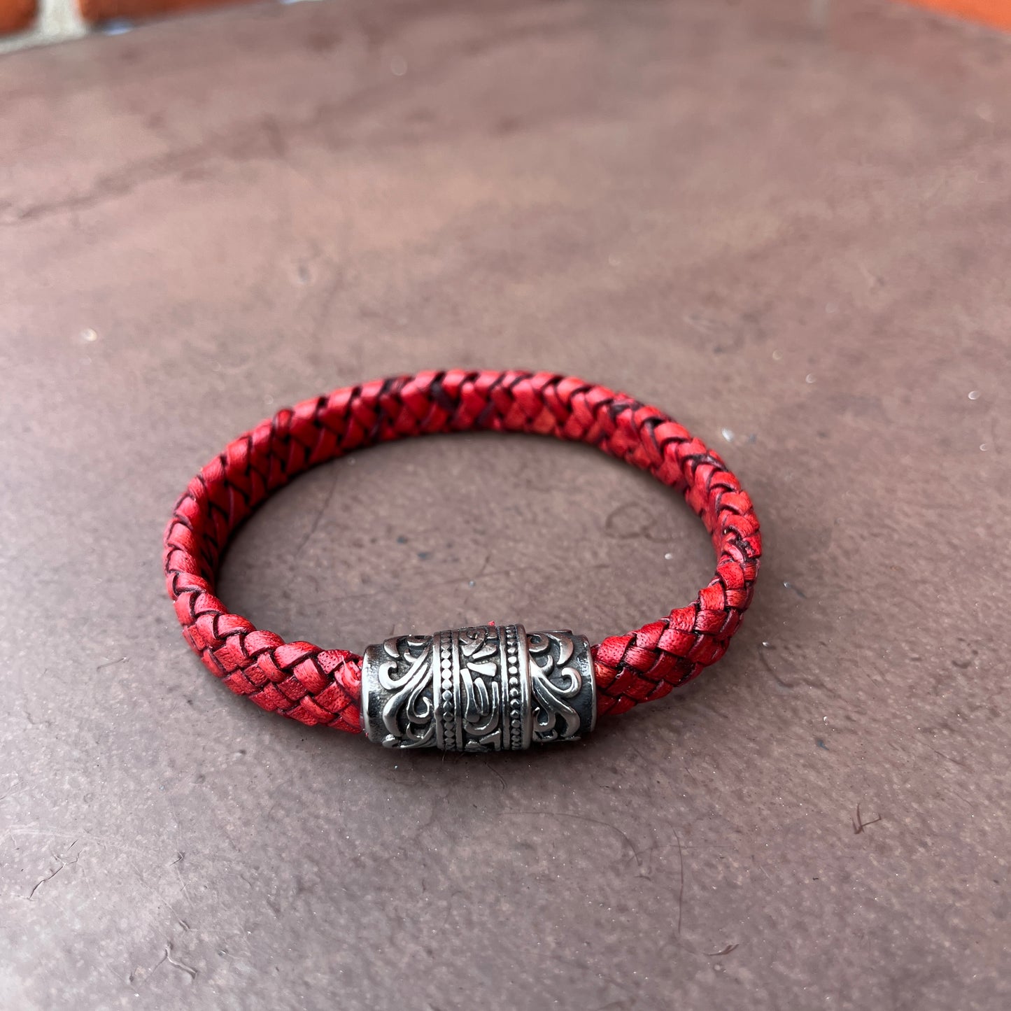 BRAIDED FLAT LEATHER BRACELET WITH STAINLESS STEEL TRIBAL MAGNET CLASP
