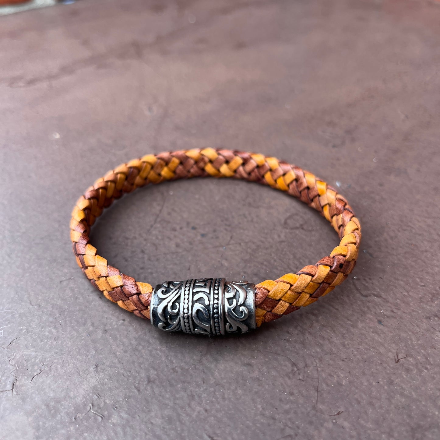BRAIDED FLAT LEATHER BRACELET WITH STAINLESS STEEL TRIBAL MAGNET CLASP