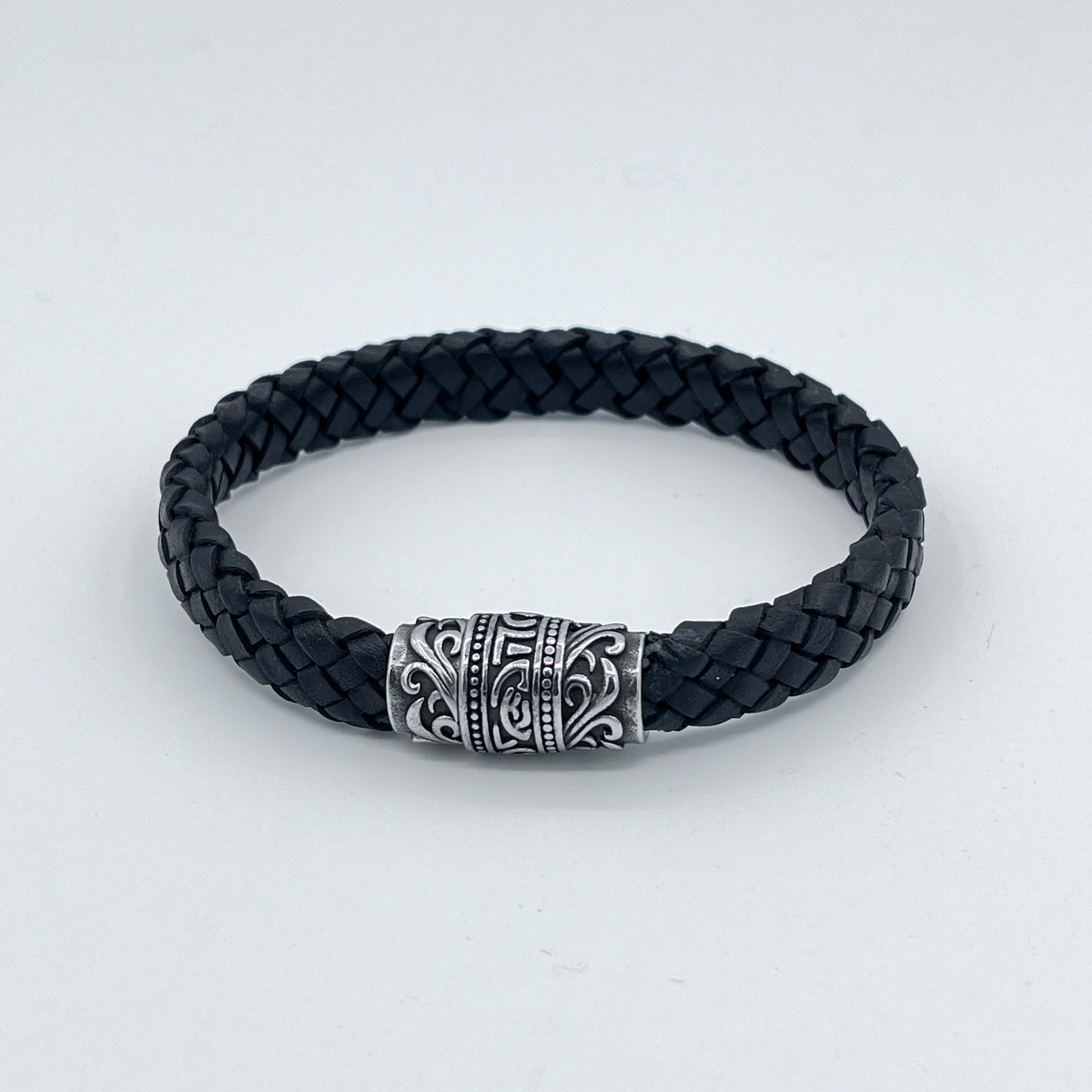 BRAIDED FLAT LEATHER BRACELET WITH STAINLESS STEEL TRIBAL MAGNET CLASP