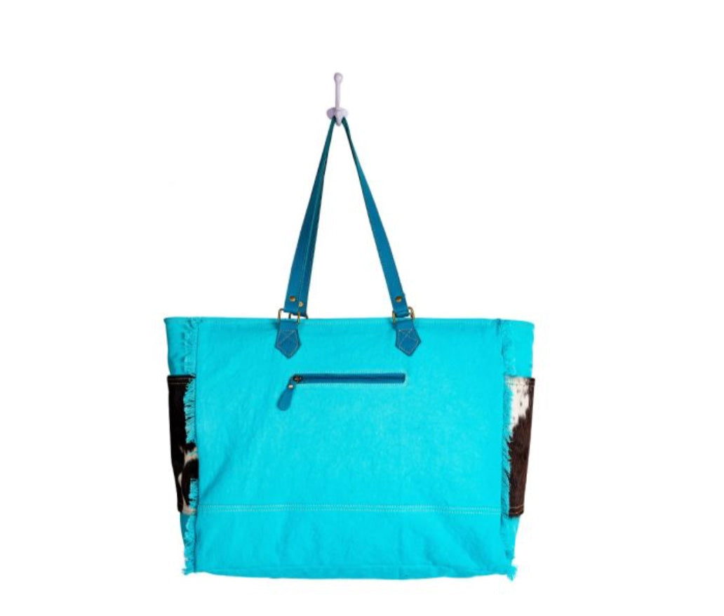 SKY FALCON CANVAS & COWHIDE HAIRON BAG IN BLUE by MYRA BAG®