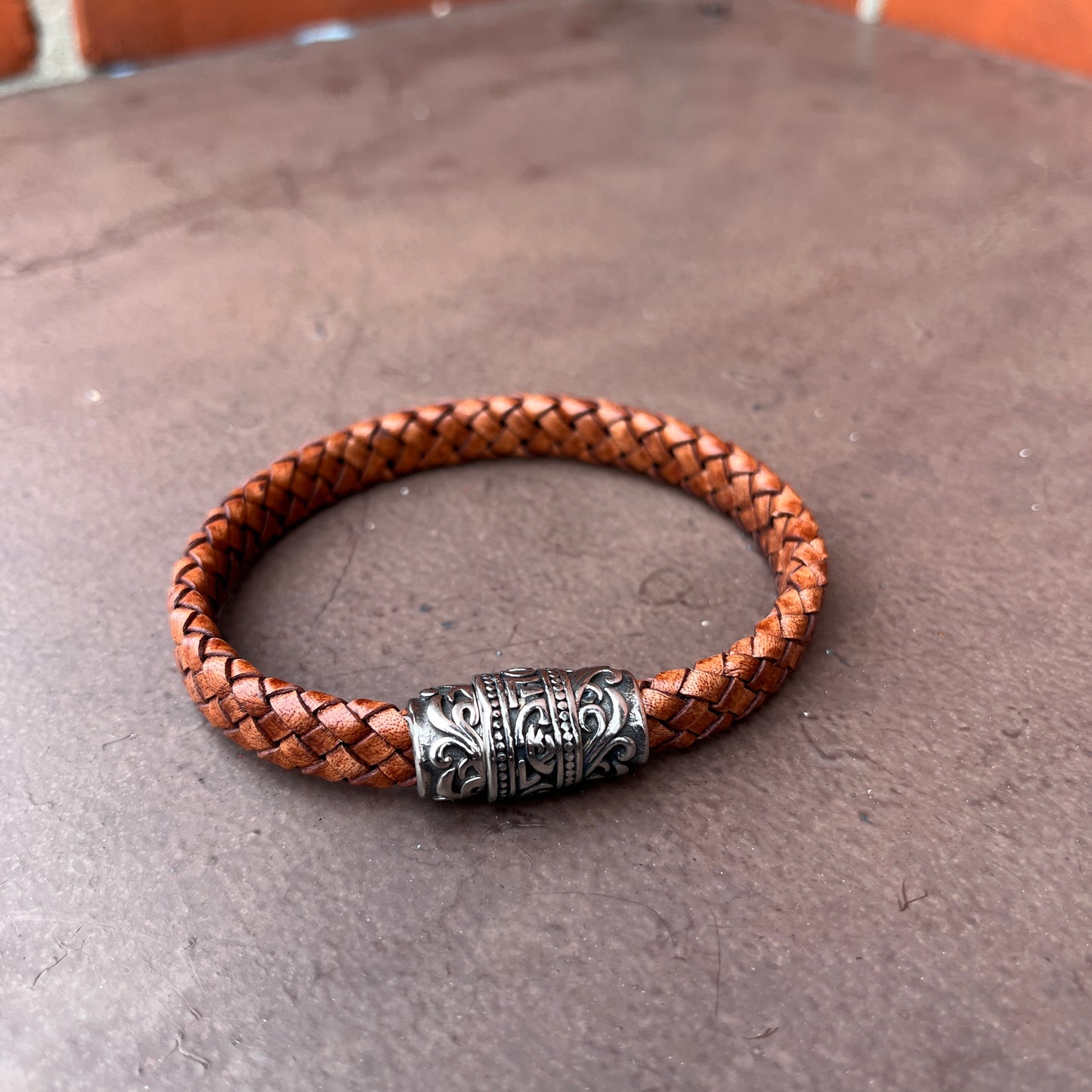 BRAIDED FLAT LEATHER BRACELET WITH STAINLESS STEEL TRIBAL MAGNET CLASP