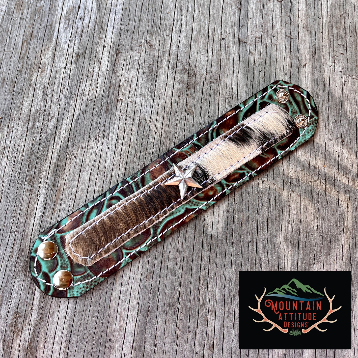 CUSTOM HANDMADE LEATHER EMBOSSED COWHIDE CUFF WITH STAR CONCHO